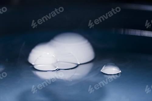 Preview: Abstract Shot With Big Soap Bubbles On A Water Surface With Smoke Inside. Image Has Grain Texture