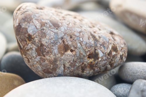 Preview: Boulders And Colorful Pebbles On The Beach On A Warm Summer Day
