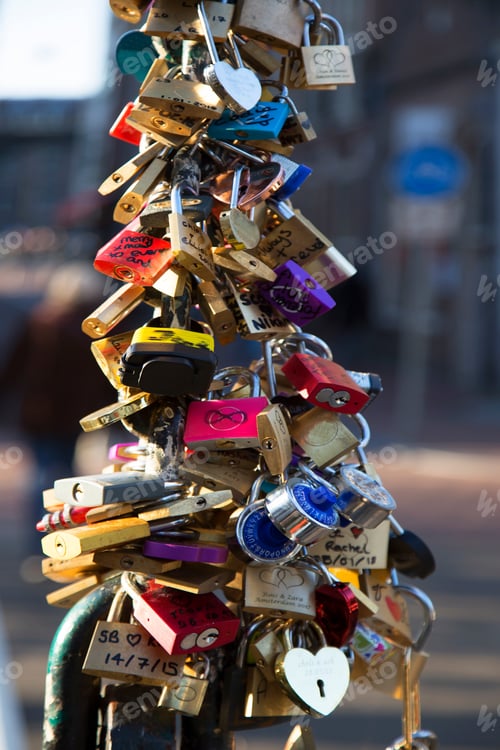 Preview: Lovers Attaching A Love Lock With Date And Name Written On It, Onto A Bridge To Remember Their Love
