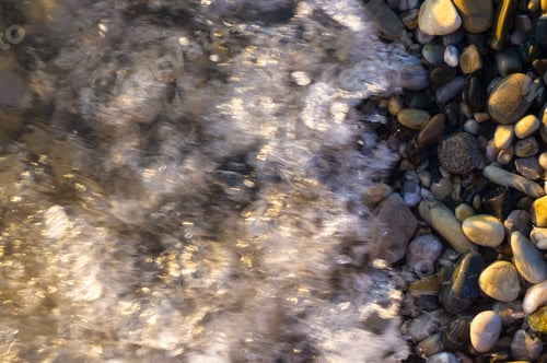 Preview: Sea Pebble Beach With Multicoloured Stones, Transparent Waves With Foam, On A Warm Summer Day
