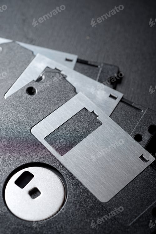 Preview: Old Floppy Disks On A Black Table.