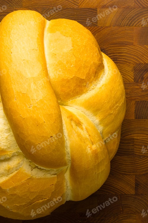 Preview: Fresh Braided Loaf Of White Wheat Bread On Wooden Background