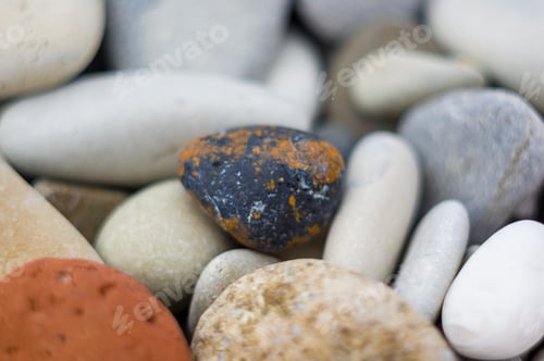 Preview: Boulders And Colorful Pebbles On The Beach
