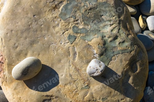 Preview: Boulders And Colorful Pebbles On The Beach