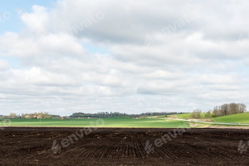 Preview: Countryside Fields In Early Spring With Clouds And Farmland