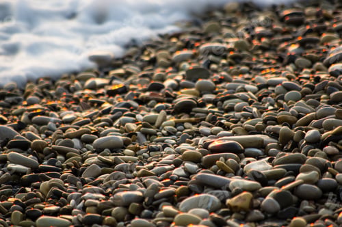 Preview: Pebble Stones On The Sea Beach, The Rolling Waves Of The Sea With Foam