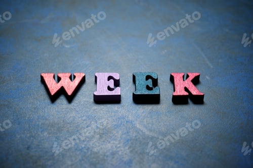 Preview: Week Word On A Blue Table.