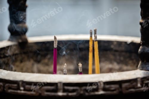 Preview: Large Bronze Brass Pot With Incense Sticks Burning Inside In The Courtyard Of The Buddhist Temple