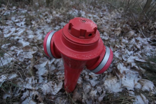Preview: Close Up Of A Red Fire Hydrant With White Lines, Outdoors On A Winter Day In Poland, Europe
