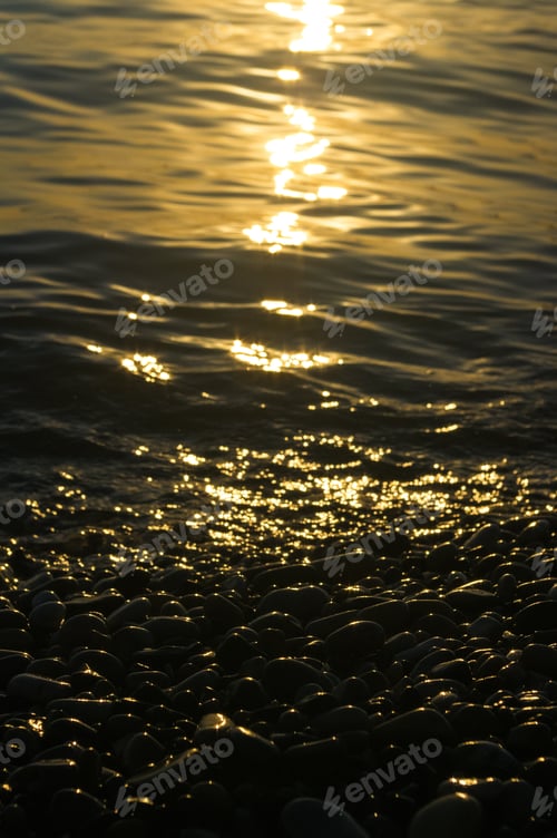 Preview: Sea Pebble Beach With Multicoloured Stones, Transparent Waves With Foam, On A Warm Evening