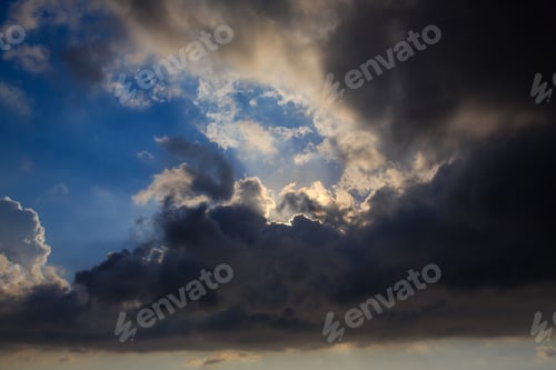 Preview: A Thundercloud With Gaps In The Blue Sky. The Sun'S Rays Through The Clouds. The Concept Of