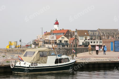 Preview: Motor Ship Anchored At Harbor Quay People Walking To Center Fishing Village