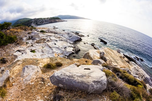 Preview: Aegean Seashore And Marble Rocks In Aliki, Thassos Island, Greece. Fish Eye Lens Effects