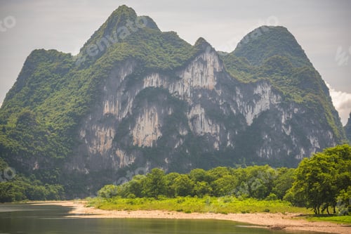 Preview: Famous Nine Horse Mural Hill Landmark Peak On The Shore Of The Magnificent Li River Flowing From