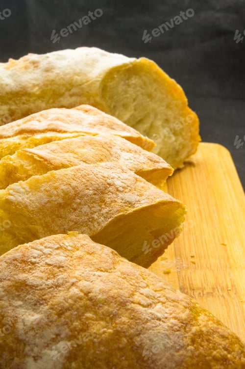 Preview: Fresh Sliced Loaf Of White Wheat Bread On Wooden Background