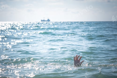Preview: Single Hand Of Drowning Man In Sea Asking For Help. Sticking Out Of The Water