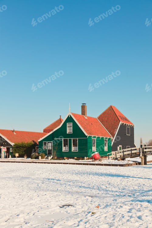 Preview: Winter Landscape Of Old Dutch Village In Snow On Beautiful Clear Day. Blue Sky.