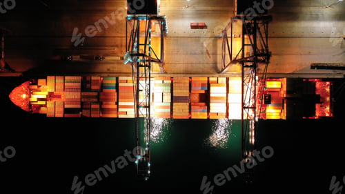 Preview: Aerial Drone Top Down Night Shot Of Illuminated Industrial Container Cargo Terminal Unloading To