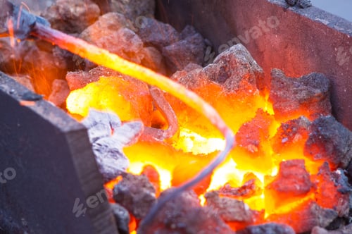 Preview: Blacksmith Furnace With Burning Coals, Tools, And Glowing Hot Metal Workpieces, Close-Up