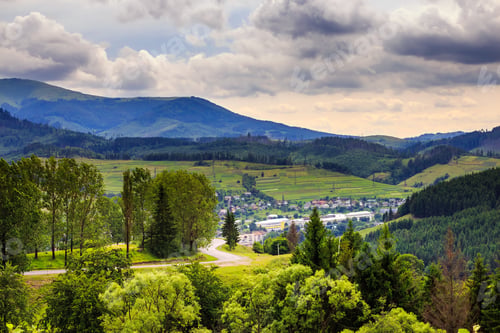 Preview: Autumn Landscape. Village On The Hillside. Forest On The Mountain Covered With Red And Yellow