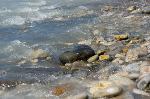 Preview: Pebble Stones On The Sea Beach, The Rolling Waves Of The Sea With Foam