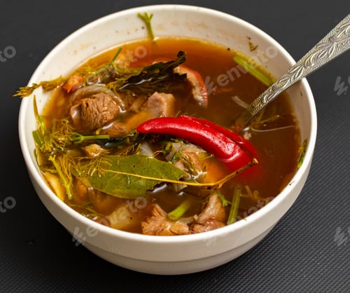 Preview: Boiled Spicy Meat Soup On Black Background