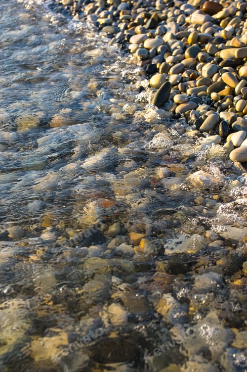 Preview: Sea Pebble Beach With Multicoloured Stones, Transparent Waves With Foam, On A Warm Summer Day