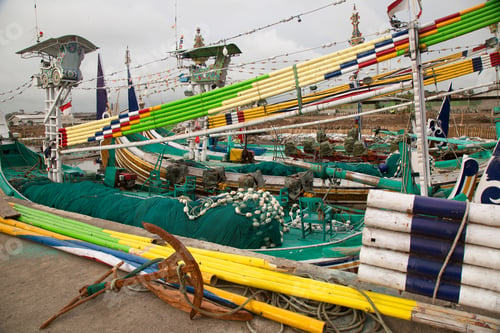 Preview: Brightly Colored And Traditional Fishing Boats Moored In An Indonesian Port, Sailors And Workmen