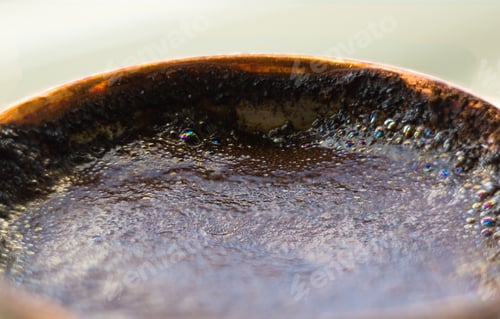 Preview: Freshly Brewed Natural Black Coffee With Foam In Traditional Copper Coffee Pot