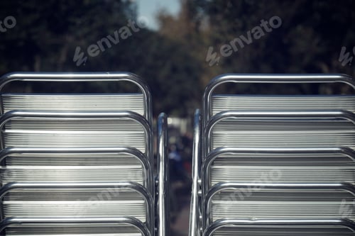 Preview: Metal Chairs Stacked In The Street.
