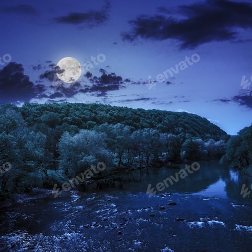 Preview: Wild River Flowing Near The Camping In Forest At The Foot Of Mountain At Night In Moon Light