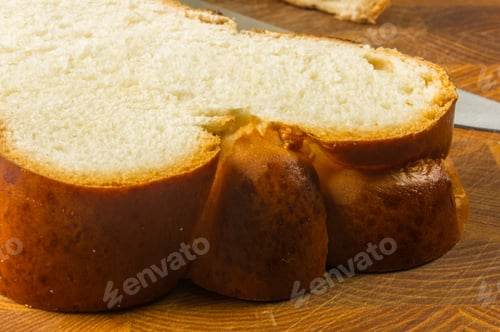 Preview: Chunks Large Braided Loaf With Knife On Wooden Background