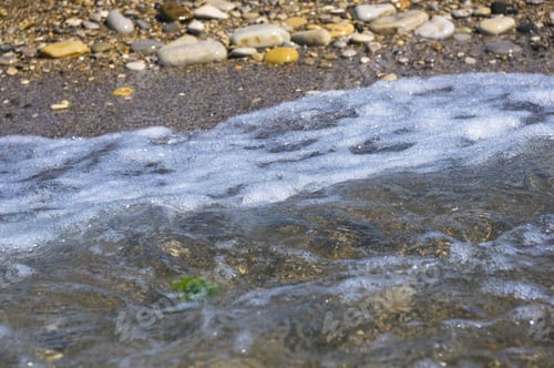 Preview: Sea Pebble Beach With Multicoloured Stones, Transparent Waves With Foam, On A Warm Summer Day