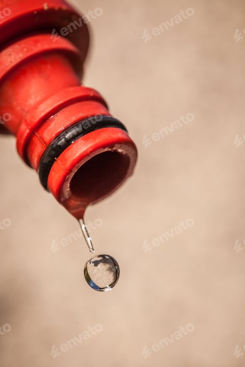 Preview: Water Dripping From The End Of A Hose.