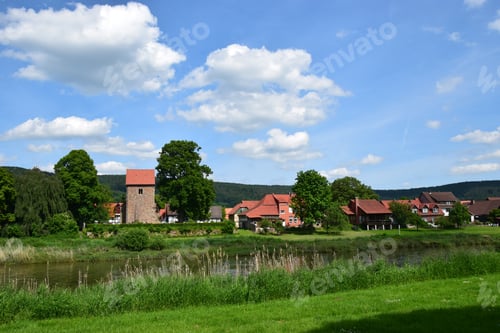 Preview: The Idyllic Village Hemeln At The River Weser With Medieval Church Tower