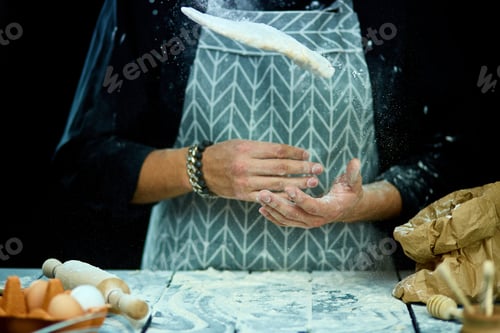 Preview: The Man, Chef Cooks Throws The Dough, Flying, Freezing In Motion. Cooking At Home. White Flour