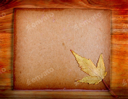 Preview: Autumnal Leaf On The Wooden Board Background
