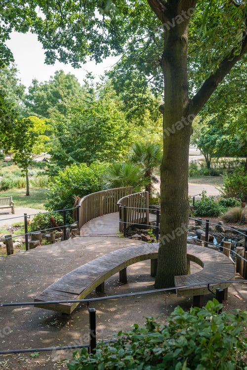 Preview: Twisted Bench Around A Tree In A Public Park In Wimbledon, London
