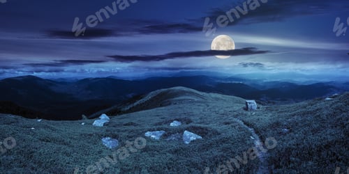 Preview: Composite Landscape With Narrow Meadow Path In Grass Among White Stones On Top Of Mountain Range At