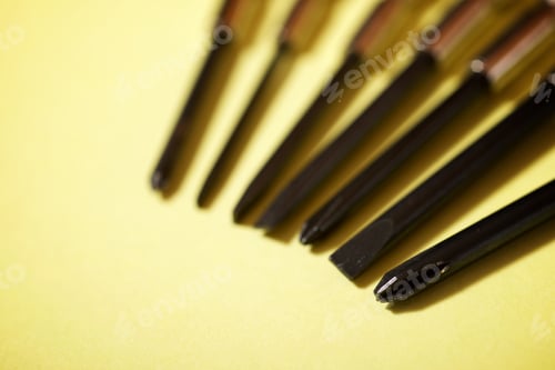 Preview: Screwdrivers On A Yellow Table