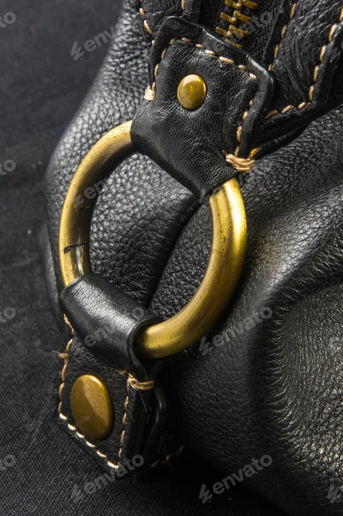 Preview: Closeup Of Buckles, Clasps, Zippers, Pockets, Fasteners, Fittings And Seams On Black Leather Hand
