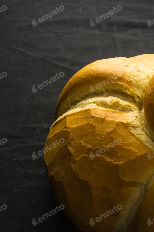 Preview: Fresh Braided Loaf Of White Wheat Bread On Black Background