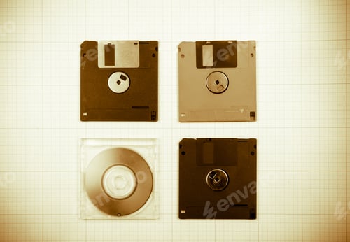 Preview: Vintage Background - Computer Floppy Disks And Mini-Cd On The Blueprint Paper, Toned