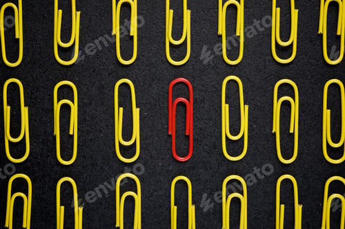 Preview: Paperclips Group On A Black Table.