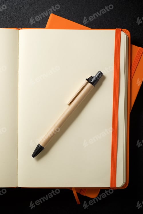 Preview: Notebooks View On A Black Table.