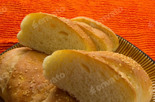 Preview: Sliced Whole Wheat Breads On A Red Plate
