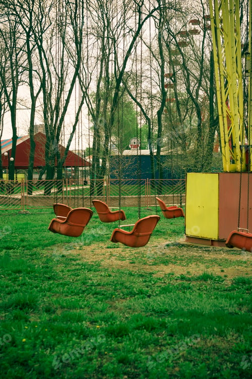 Preview: Empty Spring Old Amusement Park, Chain Swing Carousel Awaits Visitors, (Filtered For Lomo Effect)