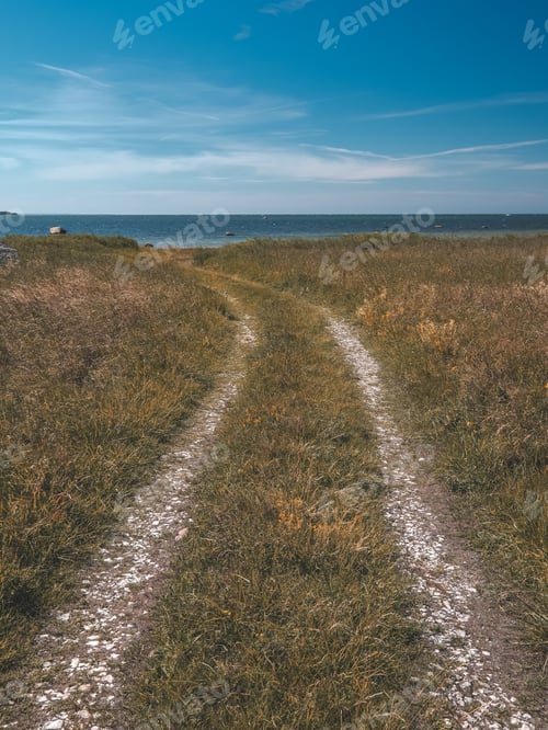 Preview: Simple Country Gravel Road In Summer At Countryside Forest With Trees Around And Clouds In The Sky