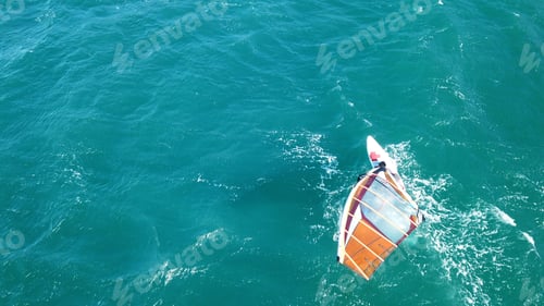 Preview: Aerial Drone Photo Of Surfer Cruising In High Speed In Mediterranean Open Wavy Sea