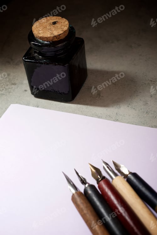 Preview: Nib Pens For Calligraphy And Inkwell On A Table.